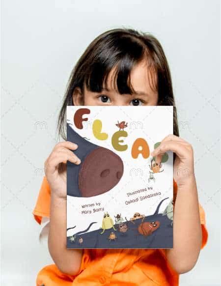 Image shows you girl with long brown hair peering over the book FLEAS that she is holding up. She is wearing a bright orange top.
