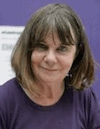 Picture of Julia Donaldson, author with brown hair coming to under her chin and a fringe. She is wearin a dark purple top and is looking straight at the camera